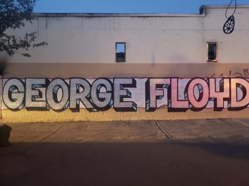 A mural dedicated to George Floyd, painted on the side of an O'Reilly Auto Parts on Lake Street, later demolished after fire damage. photo credit: Mira Klein